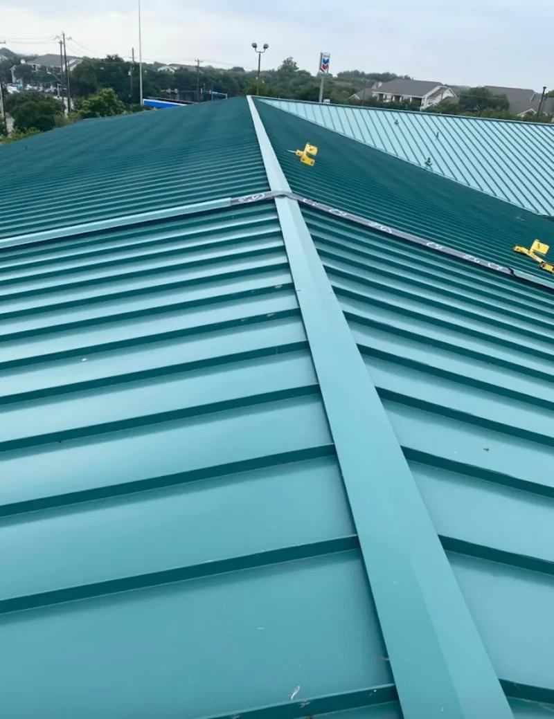 Green commercial metal roof ridge and valley for Metal Roof Repair in New Richmond