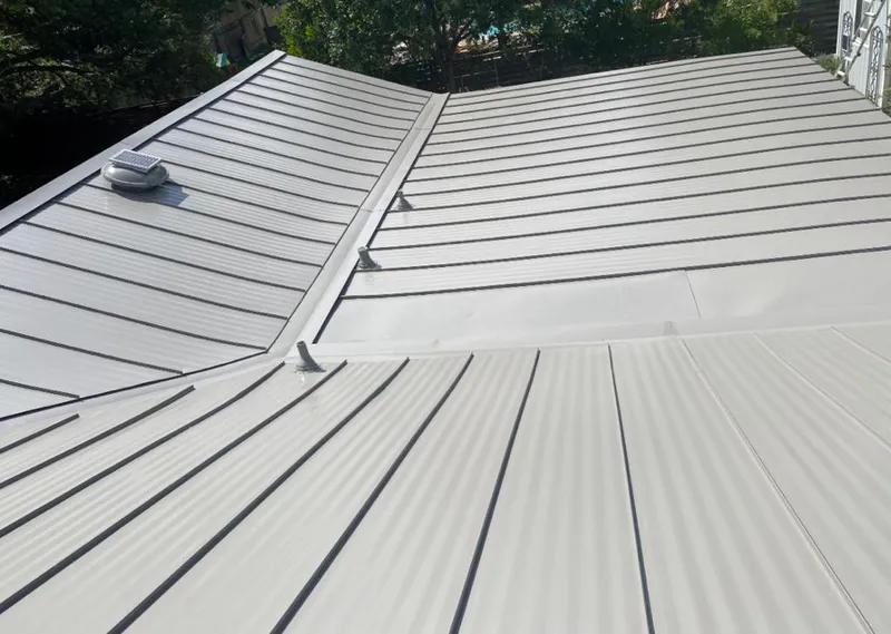 Solar attic fan installed on a metal roof for Roof Ventilation in New Richmond